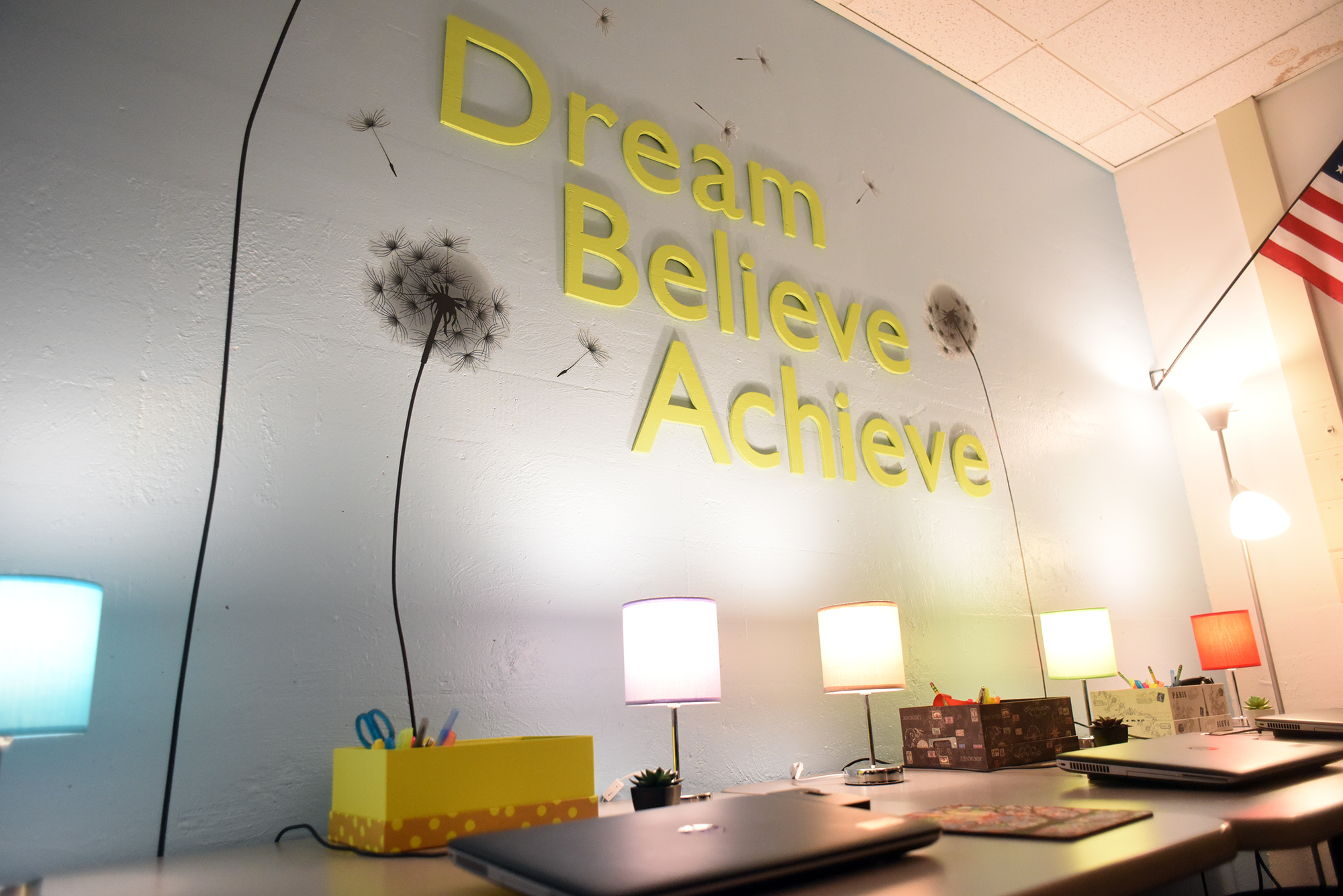 The Dream, Believe, Achieve sign in the ACC Classroom.