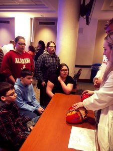 Kassidy Hogan, Courtney Euler, Amber Chrisman, Ryan Hazlett and Zach Sanders learn about the anatomy of the human heart from New Visions Students.
