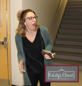 person with a surprised look standing in a school stairwell