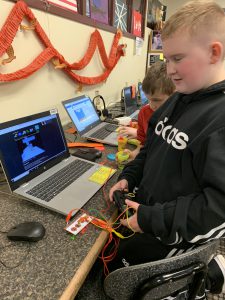 Student uses science kit to create a game controller out of Play-Doh.