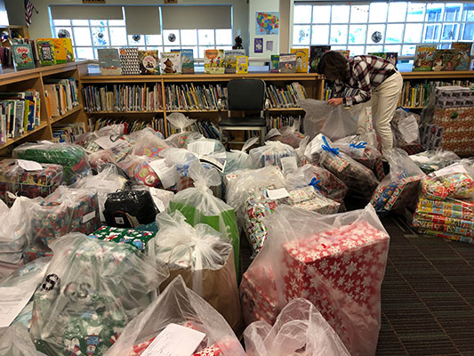 library filled with bags of gifts