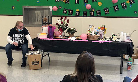 Dawn Surnear opens gifts at retirement event