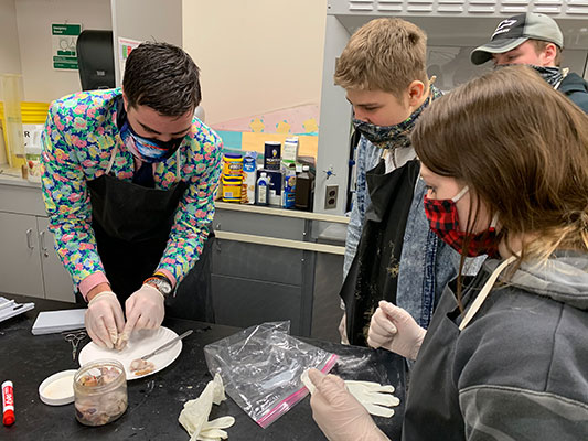 Patrick Petty teaches Living Environment students about a sheep eye