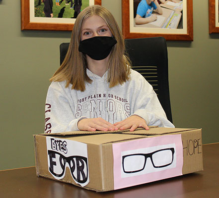 Sarah Paradiso with Eyes For Hope donation box