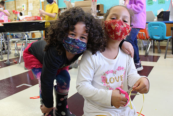 two students smiling together