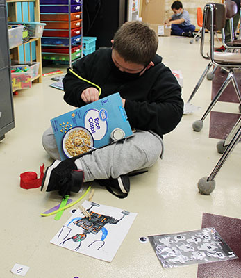 student working on monster trap