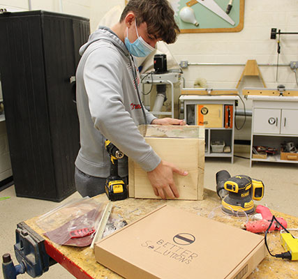 student building wooden display box