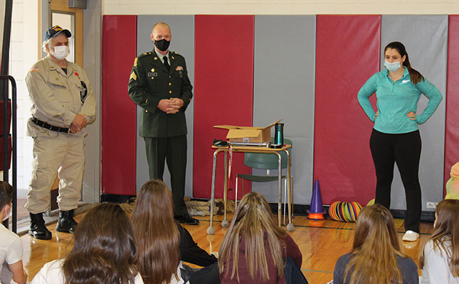 Commanders Ellwood and Maynard and Allie Swing talking to students