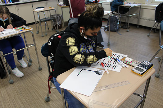 students coding at desks