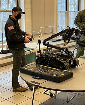 officer operating a robot