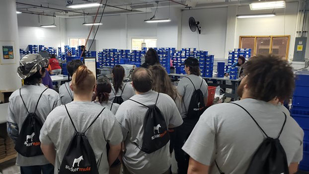 students in a group touring the facility