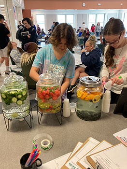 students with fruit-infused water
