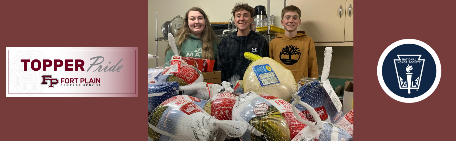 3 students standing in front of donated turkeys