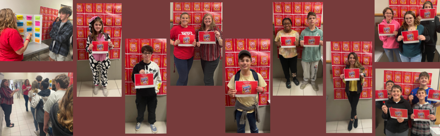 students and staff holding Drug Free Week signs and lollipops 