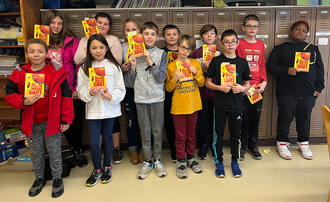 group of students holding books