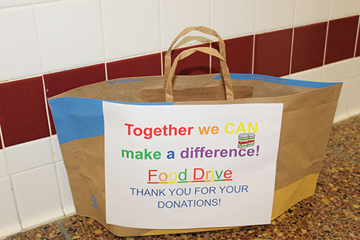 A collection bag for the senior center food drive 