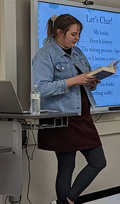 Allyson reading from a book