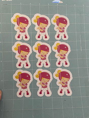 Finished baseball cutouts of girl baseball players