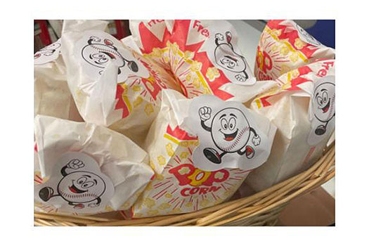 bags of popcorn with running baseball character on them