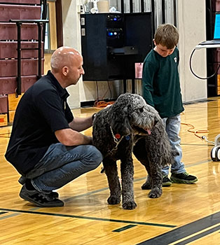 police officer, dog and student